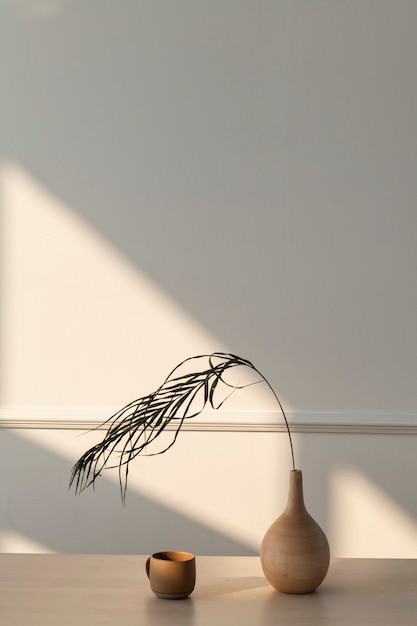 Minimal wooden vase in a white room with a natural light