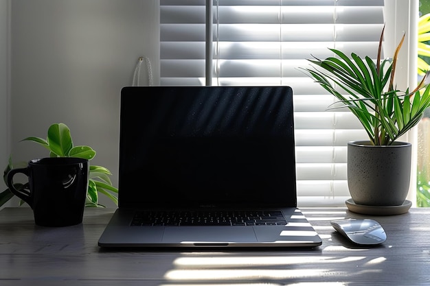 Minimalist Home Office Setup A stylish modern home office setup with a sleek laptop a potted plant a cup of coffee and minimal desk accessories