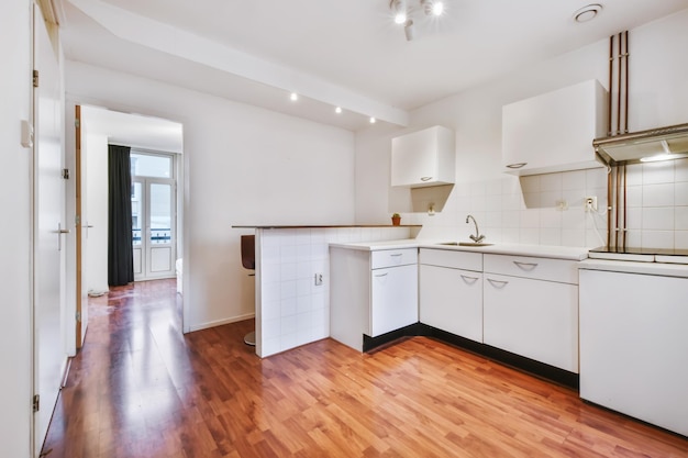 Minimalist kitchen with a snow-white kitchen set