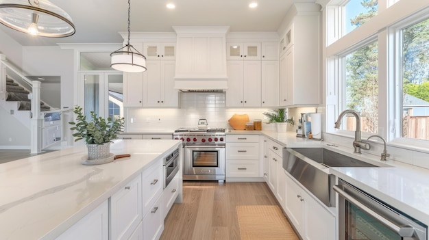 Minimalist Kitchen with White Cabinets and a Stainless Steel Sink