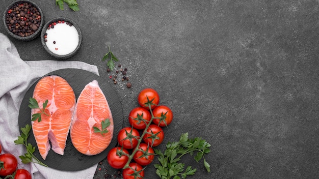 Minimalist salmon dish and tomatoes top view