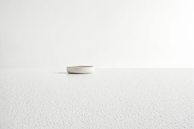 Photo minimalist white bowl on a white table