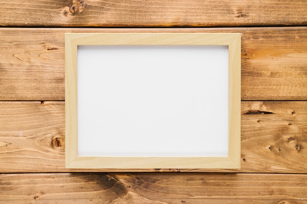 Minimalist wooden frame with wooden background