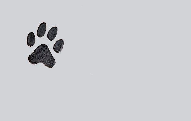 a minimalistic paw print tattoo with clean and simple outlines