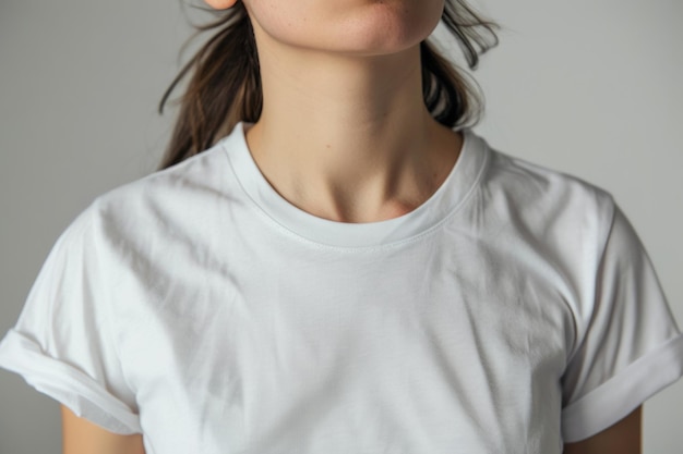 Minimalistic portrait focusing on a plain white tshirt worn by an unidentified woman