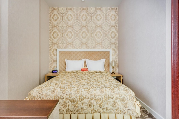 MINSK BELARUS DECEMBER 2020 Interior of the modern luxure bedroom in studio apartments or hotel in light color style