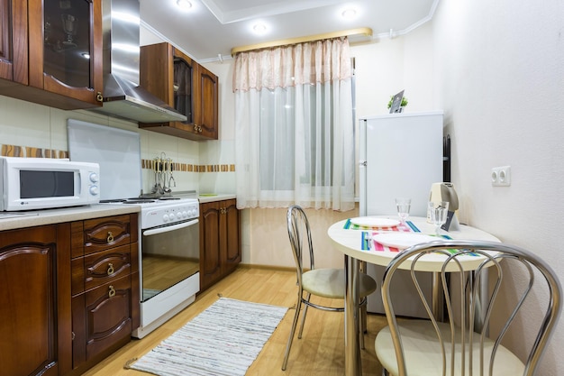 MINSK BELARUS DECEMBER 8 2017 Interior of the modern wooden kitchen in loft flat in minimalistic style