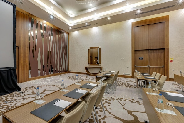 MINSK BELARUS JULY 2017 rows of seats in interior of modern empty conference hall for business meetings