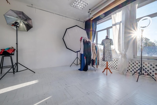 MINSK BELARUS MAY 2020 interior of daylight photo studio with lighting equipment and a place for a makeup artist for nude and fashion filming