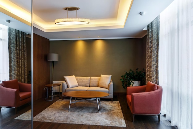 MINSK BELARUS SEPTEMBER 2019 Interior of the modern luxure guestroom in studio apartments or hotel in brown light color style