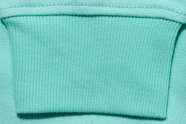 Mint cotton sweater sleeve close up