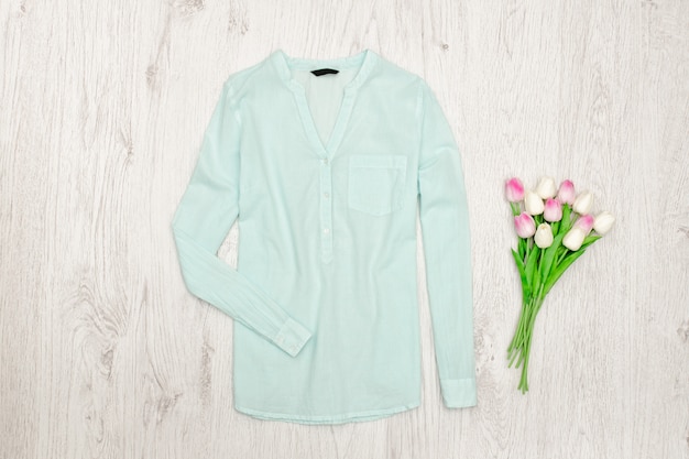 Mint green blouse and bouqet of tulips