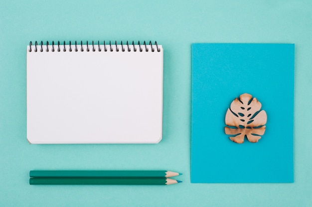 Mint green working desk with envelope