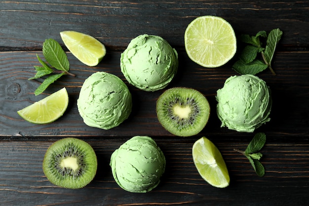 Mint ice cream balls and ingredients on wooden