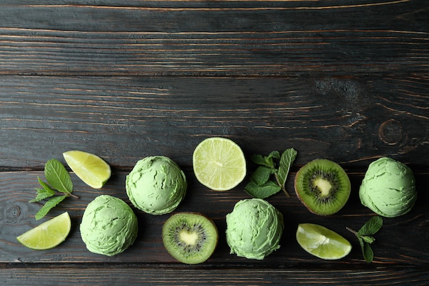 Mint ice cream balls and ingredients on wooden