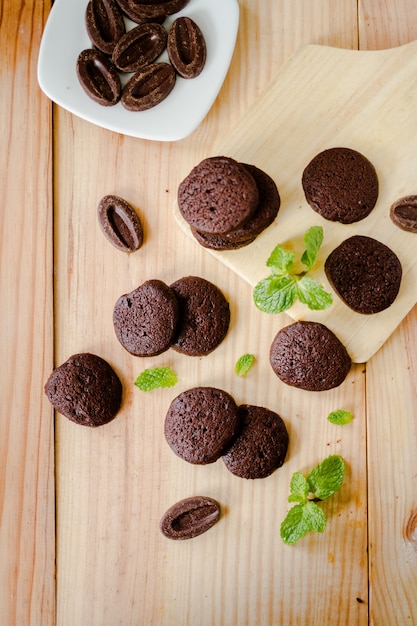 Mint Leaf and Chocolate Cookies on wood board