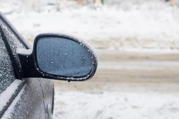 Mirror car covered with snow