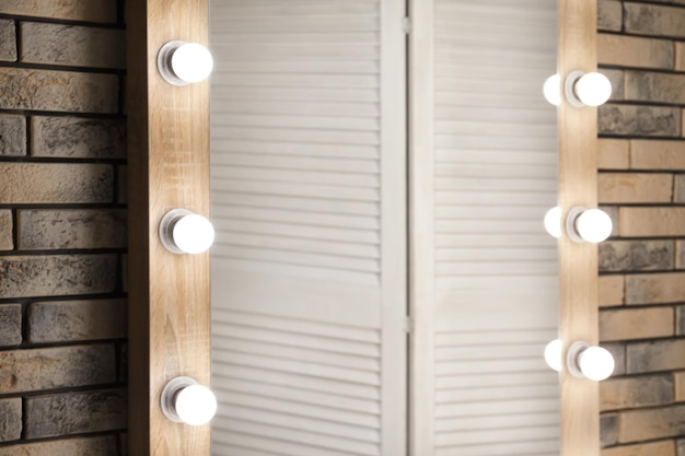 Mirror with lamps in modern makeup room