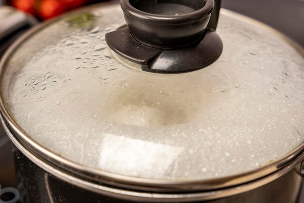 The misted lid of a pot of boiling water