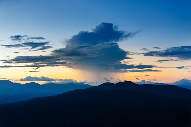 Misty forest in Mountain Landscape at twilight sunset