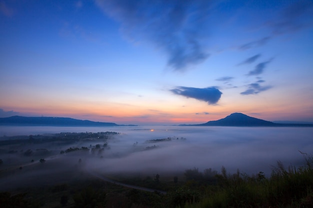 Misty morning sunrise and road in mountain at Khaokho PhetchabunThailand