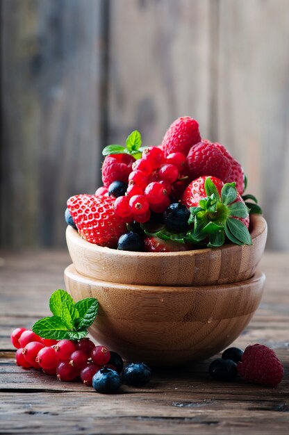 Mix of berries on the wooden table