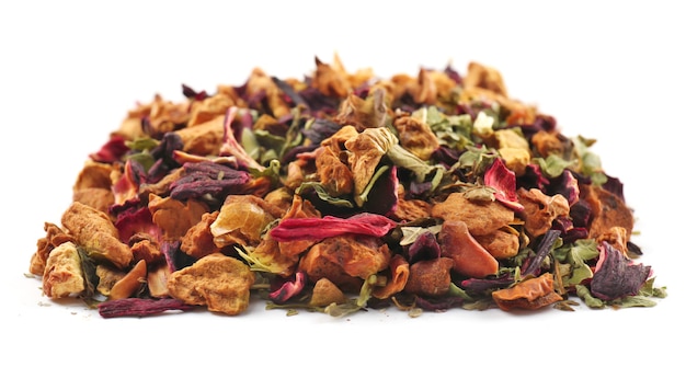 Mix of dry tea, fruits and flower petals, isolated on white