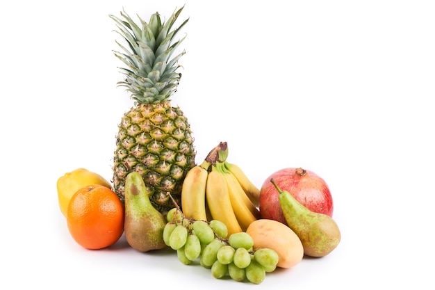 Mix of fresh juicy colorful exotic tropical fruits on white background