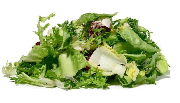 Mix of lettuce leaves escariole frisee radicchio arugula on a white isolated background dietary healthy food