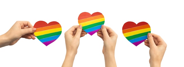 Mix of LGBT rainbow heart in hands isolated on a white background, banner design, gay, lesbian, pride month, concept photo