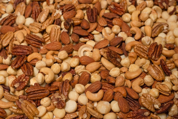 Mix of nuts as a background. Top view.