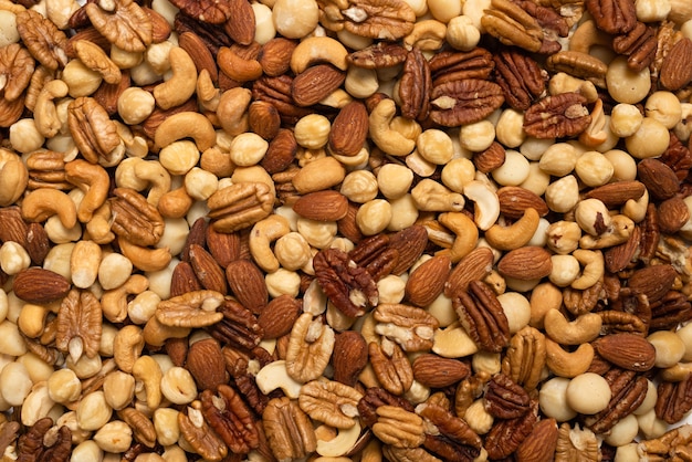 Mix of nuts isolated on white background. Top view.