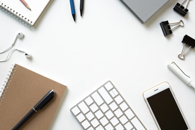 Mix of office supplies and business gadgets on a modern office desk