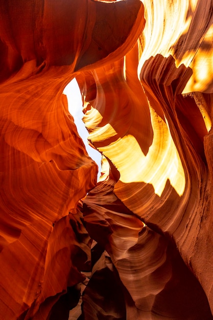 Mix of orange and red textures and curves in Lower Antelope and the blue sky above in Arizona