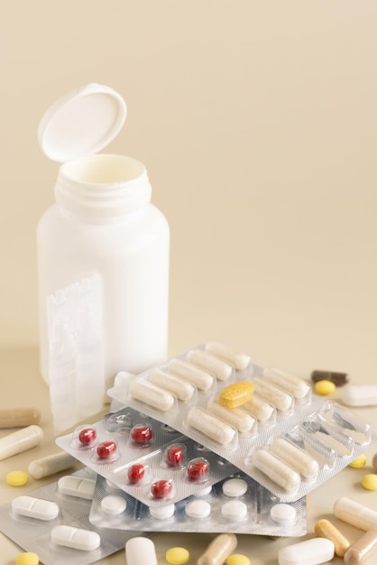 Mix of pills and capsules in a used plastic blisters close up copy space Dietary supplements