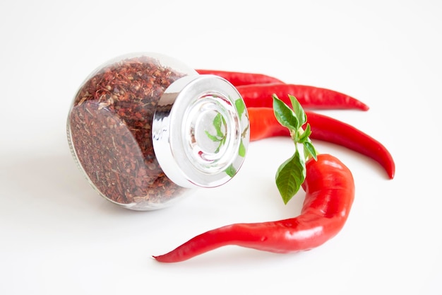 Mix of spices in a glass jar Red chili peppers Cooking The ingredients Organic food