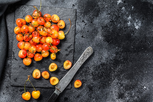 Mix of yellow and red ripe cherries