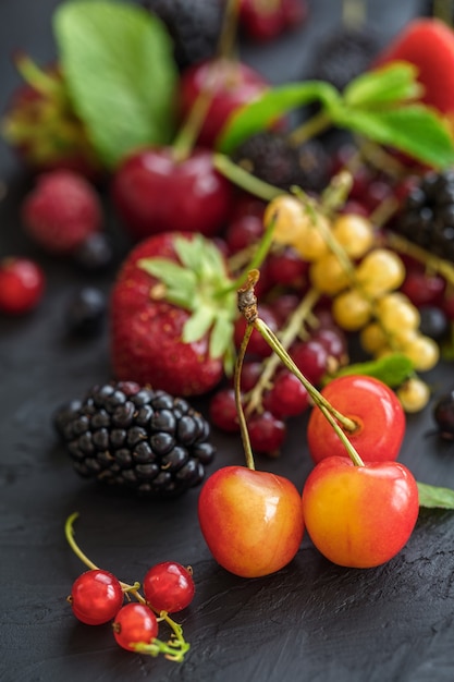 Mixed berries on a dark table arrangement