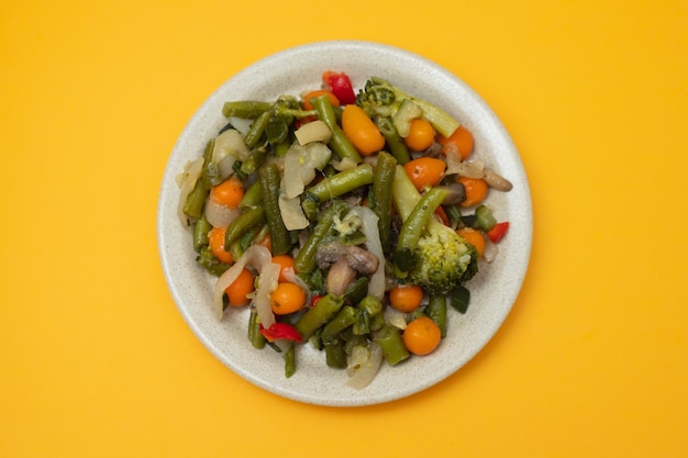 Mixed boiled vegetables on light brown dish