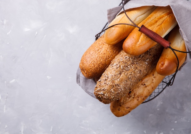 Mixed breads  in a metal basket Baguettes.