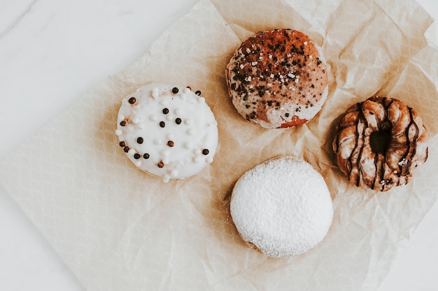 Mixed donuts on a brown paper