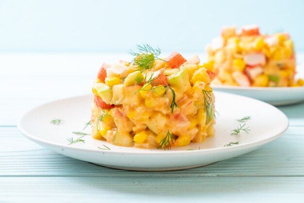 mixed fruit salad with crab stick (apple, corn, papaya, pineapple)