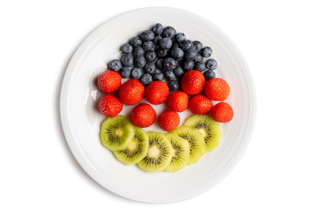 Mixed fruit in white plate isolated on white background clipping path