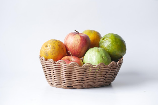 Mixed fruits in a bowl on table