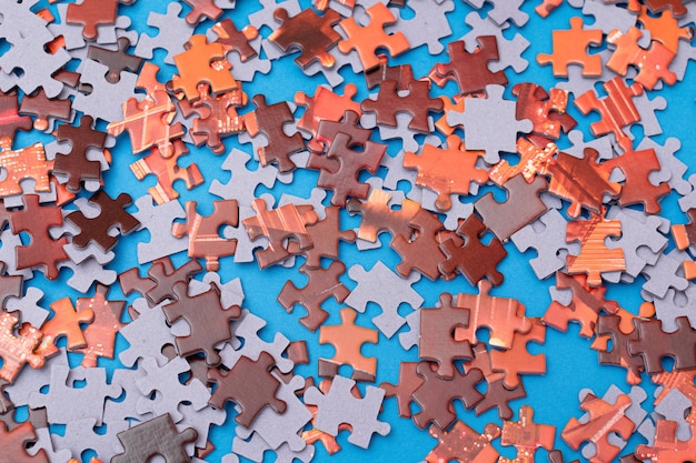 Mixed jigsaw puzzle peaces background