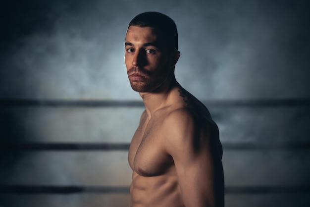 Mixed martial artist posing in a ring High quality photo