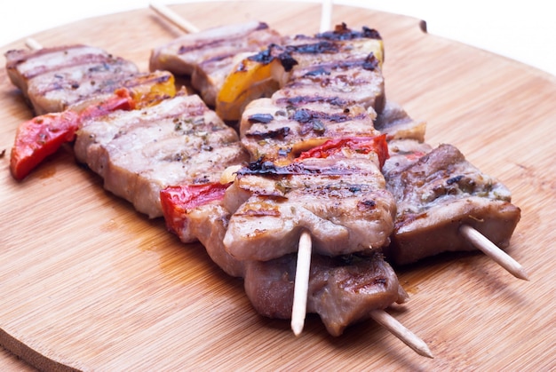 Mixed meat skewer on wooden