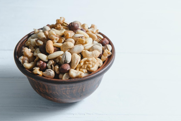 Mixed nuts on a plate White background