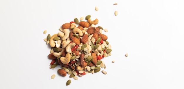 mixed organic cereal and grain seed pile on white background. 