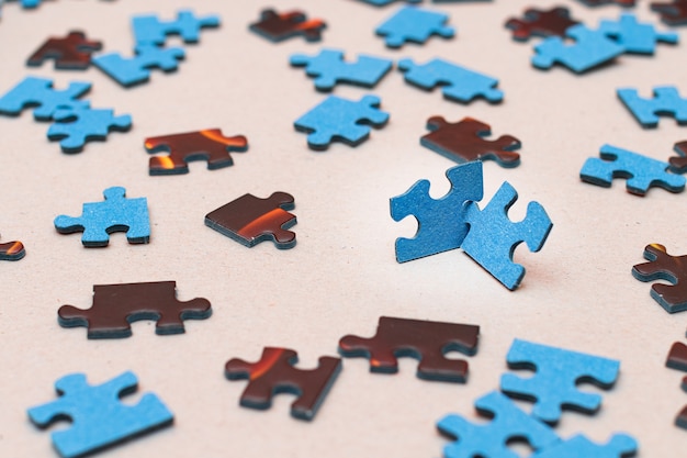 Mixed peaces of a colorful jigsaw puzzle  strategy and solving problem concept